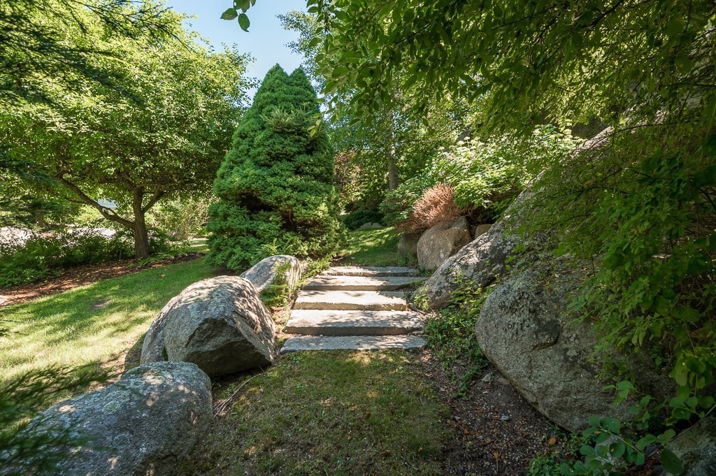 15 Cliff Road Gloucester, MA 01930 - Photo 36 of 42 a backyard of a house with a yard and outdoor seating