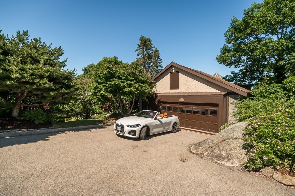 15 Cliff Road Gloucester, MA 01930 - Photo 40 of 42 a car parked in front of a white house