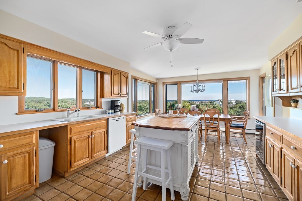 15 Cliff Road Gloucester, MA 01930 - Photo 7 of 42 a kitchen with lots of counter top space and dining table