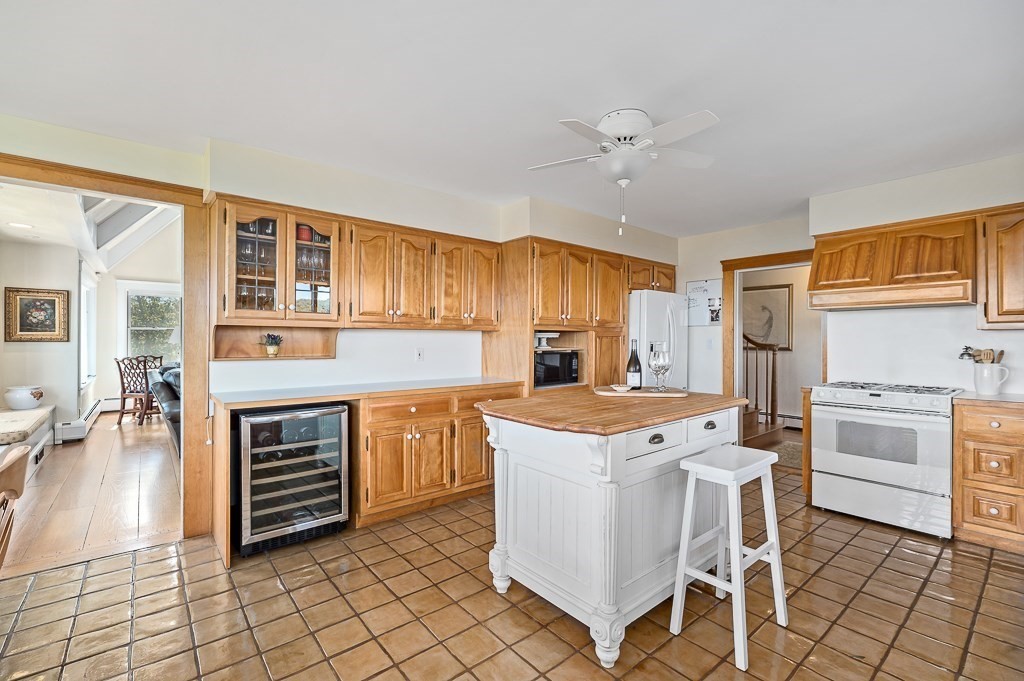 15 Cliff Road Gloucester, MA 01930 - Photo 8 of 42 a kitchen with a stove a sink and a refrigerator
