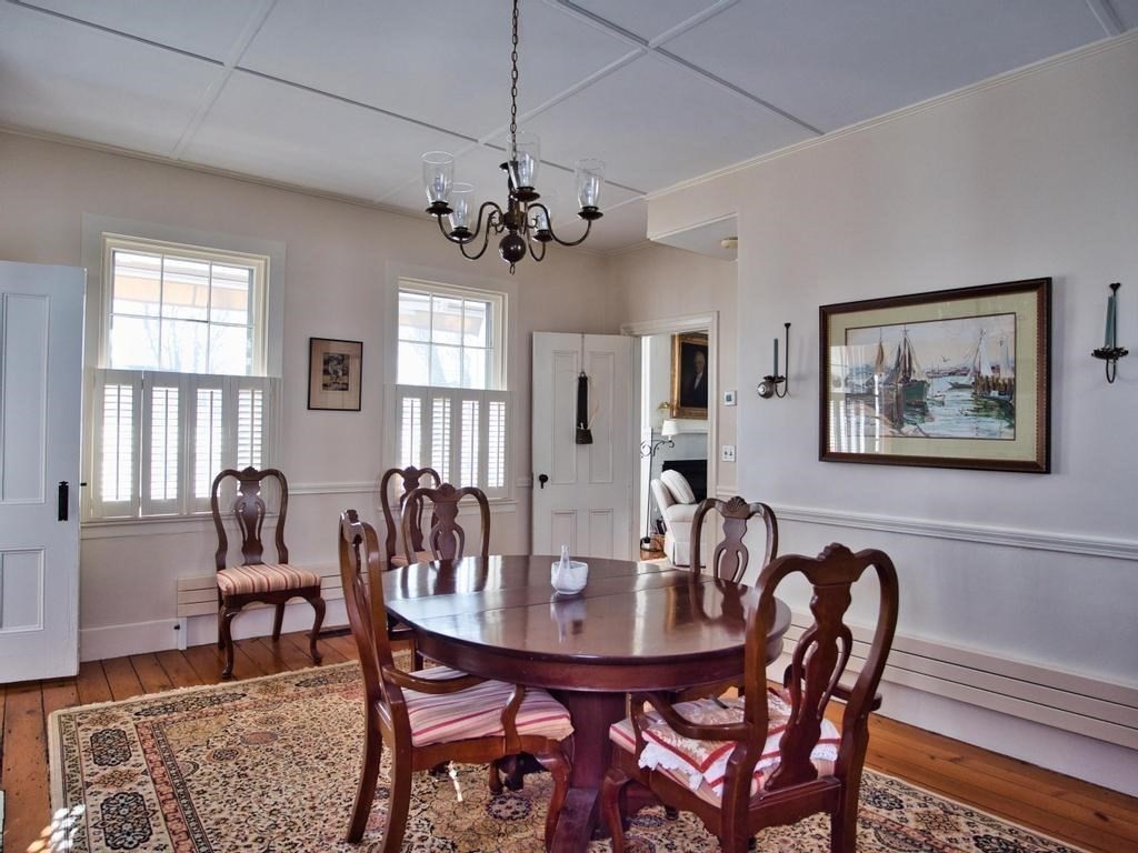 1958 Main Road Westport, MA 02791 - Photo 17 of 28 a view of a dining room with furniture window and wooden floor