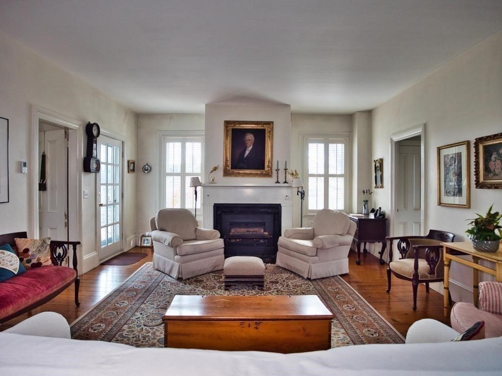 1958 Main Road Westport, MA 02791 - Photo 19 of 28 a living room with furniture and a fireplace