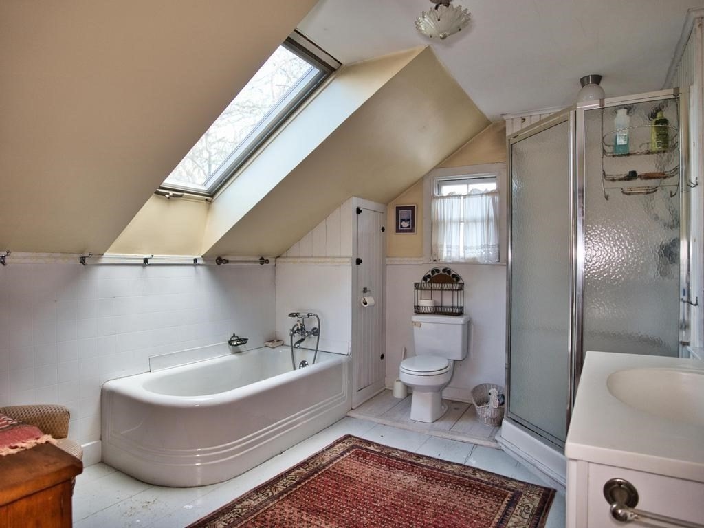 1958 Main Road Westport, MA 02791 - Photo 25 of 28 a bathroom with a bathtub and toilet