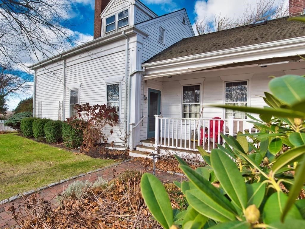 1958 Main Road Westport, MA 02791 - Photo 6 of 28 a front view of a house with a garden