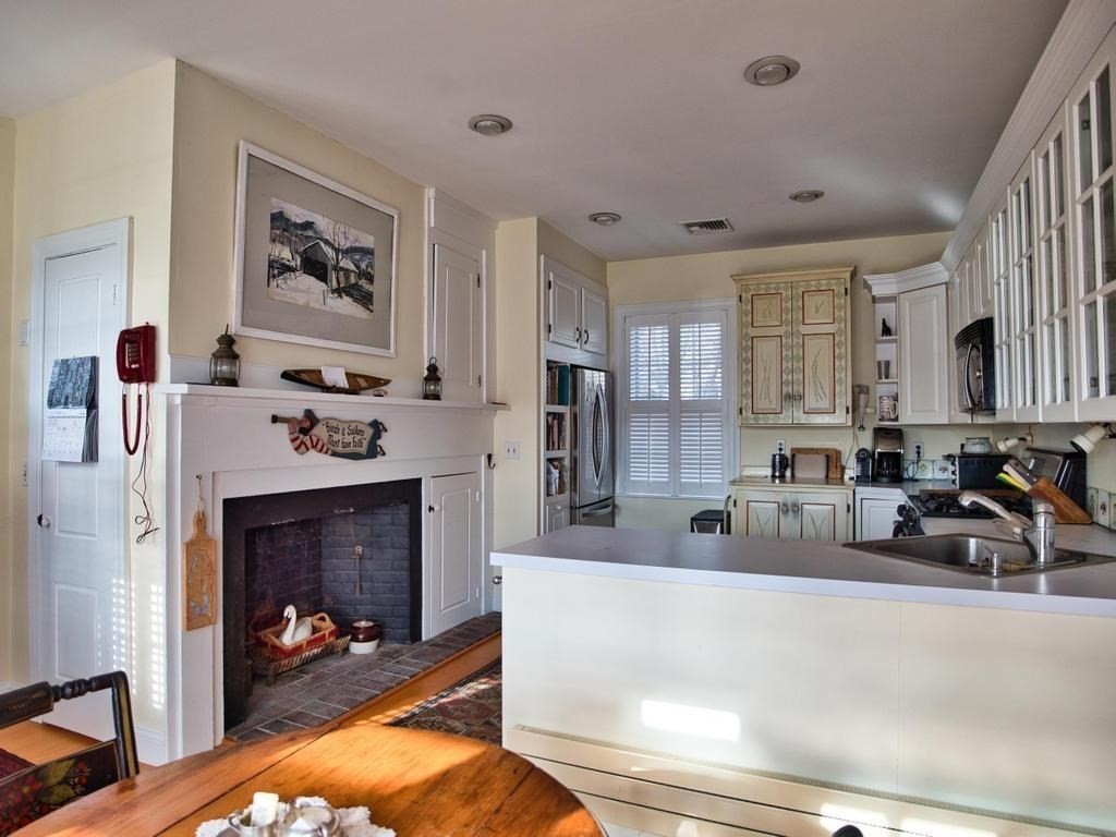 1958 Main Road Westport, MA 02791 - Photo 8 of 28 a living room with furniture and a fireplace