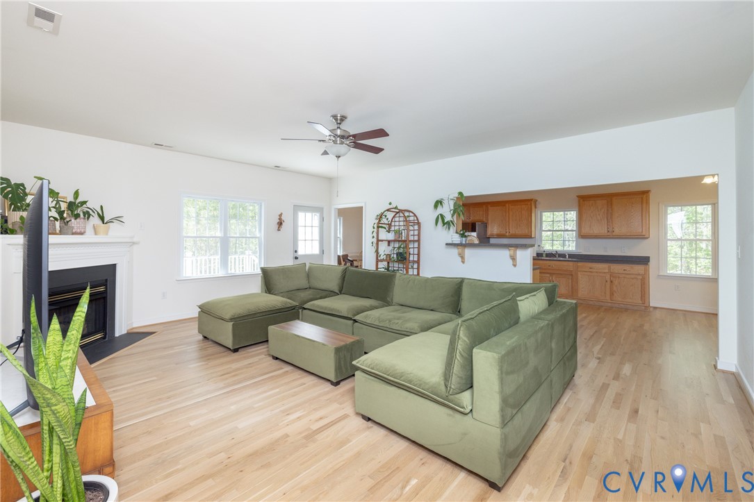 15618 Rowlett Road Chesterfield, VA 23838 - Photo 2 of 29 a living room with furniture and a fireplace