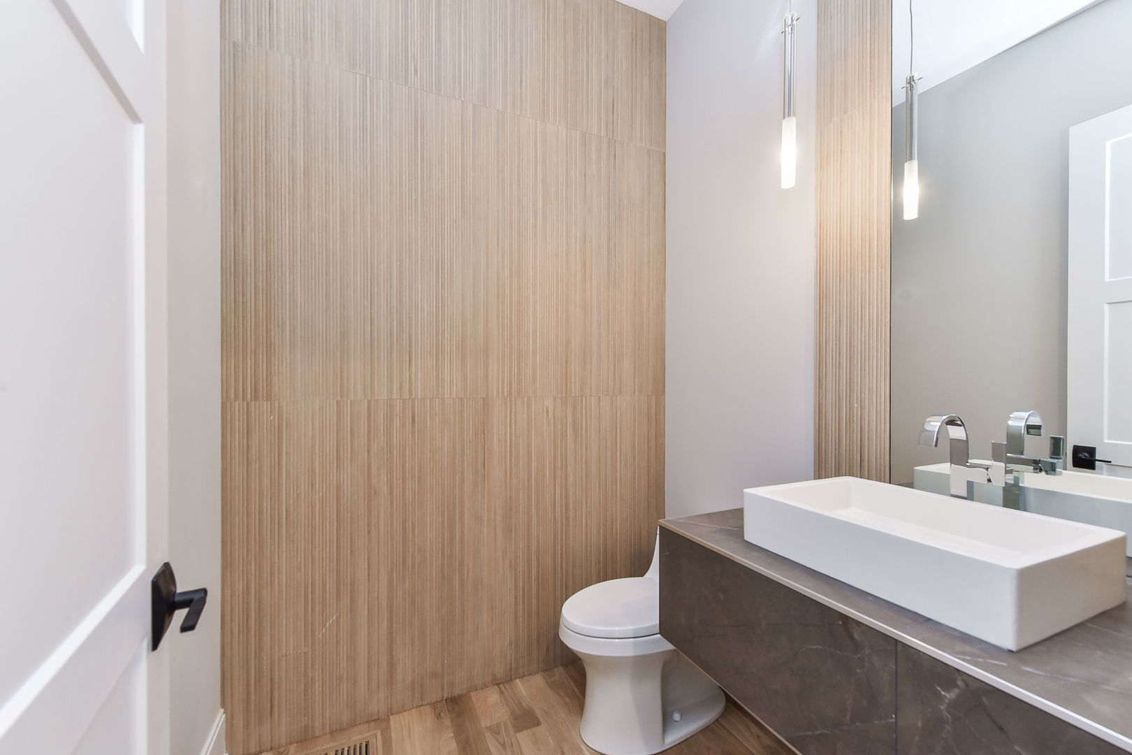 719 North Brainard Street Naperville, IL 60563 - Photo 6 of 17 a bathroom with a toilet a sink and a mirror