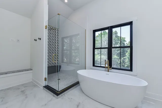 a bathroom with a glass shower door