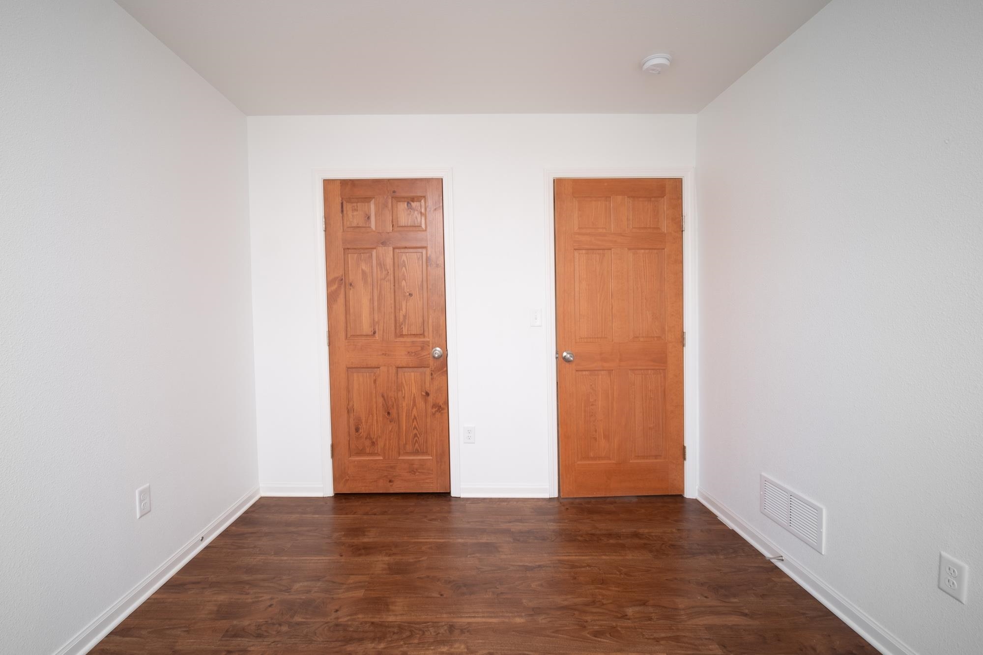 3030 Hiddengreen Drive Belvidere, IL 61008 - Photo 16 of 24 an empty room with wooden floor and closet