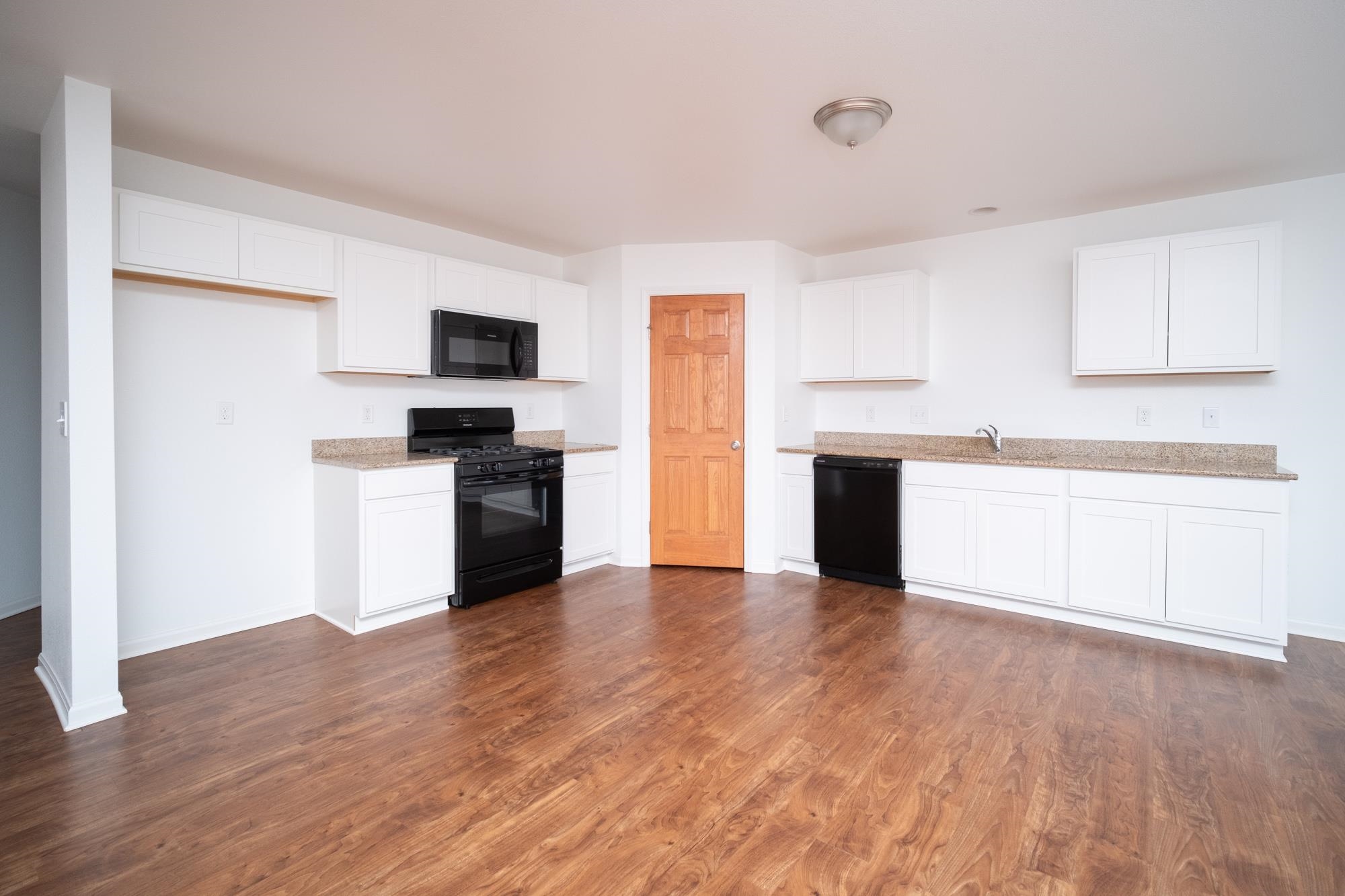 3030 Hiddengreen Drive Belvidere, IL 61008 - Photo 5 of 24 a view of kitchen with wooden floor and electronic appliances
