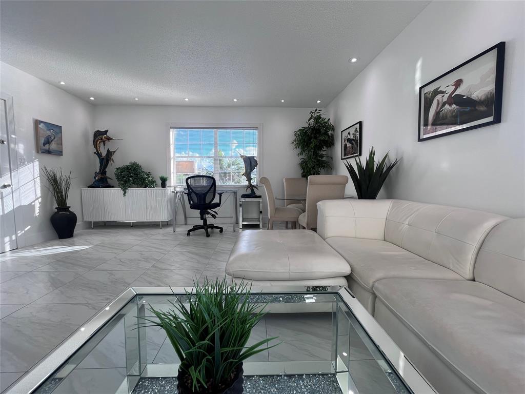 601 Southeast 5th Court, Unit 301 Fort Lauderdale, FL 33301 - Photo 11 of 28 a living room with furniture and wooden floor