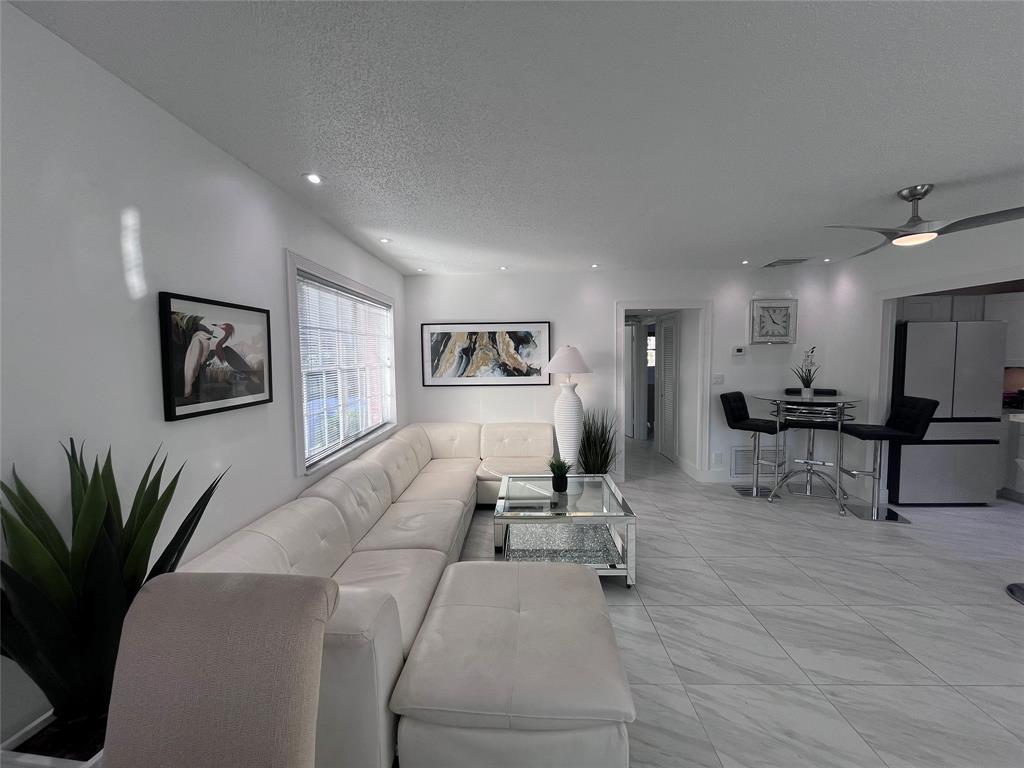 601 Southeast 5th Court, Unit 301 Fort Lauderdale, FL 33301 - Photo 12 of 28 a living room with furniture and a potted plant