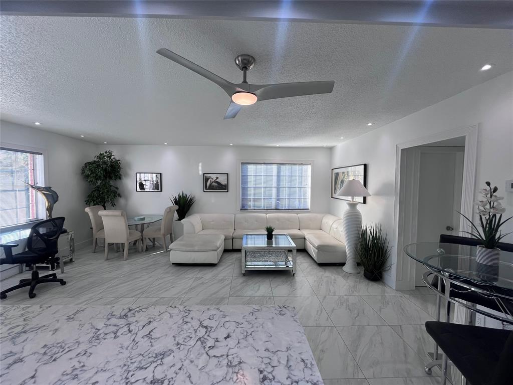 601 Southeast 5th Court, Unit 301 Fort Lauderdale, FL 33301 - Photo 13 of 28 a living room with furniture and a window