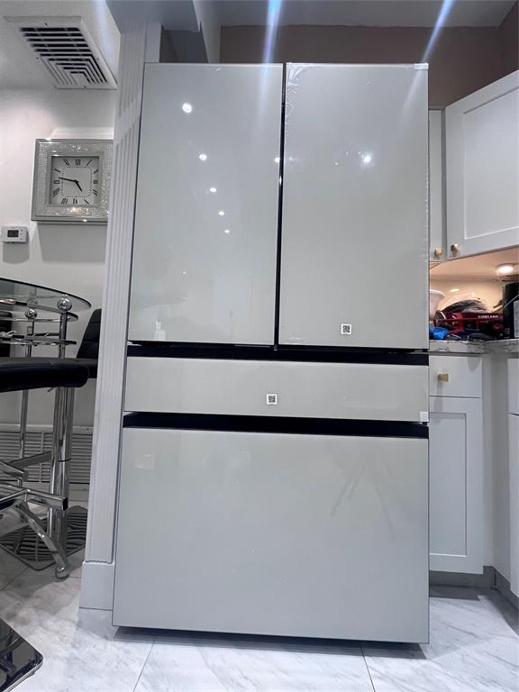 601 Southeast 5th Court, Unit 301 Fort Lauderdale, FL 33301 - Photo 28 of 28 a kitchen with a refrigerator and a stove