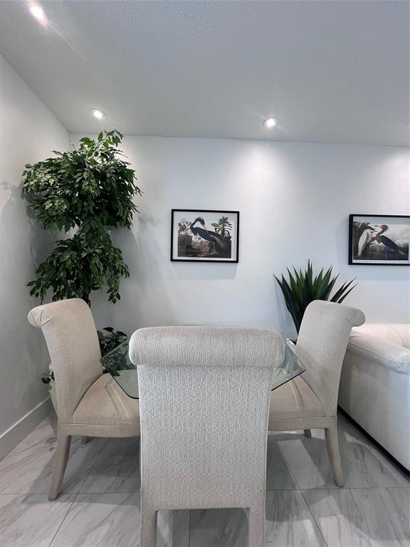601 Southeast 5th Court, Unit 301 Fort Lauderdale, FL 33301 - Photo 4 of 28 a living room with furniture flowerpot and a potted plant