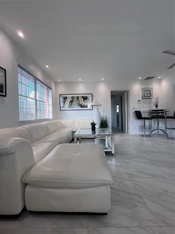 a living room with furniture and a table
