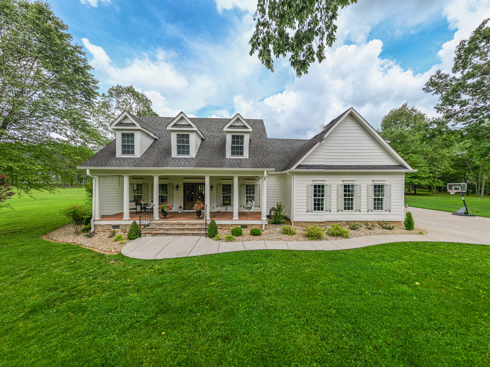 9251 Link Road Christiana, TN 37037 - Photo 1 of 40 a front view of a house with swimming pool and chairs