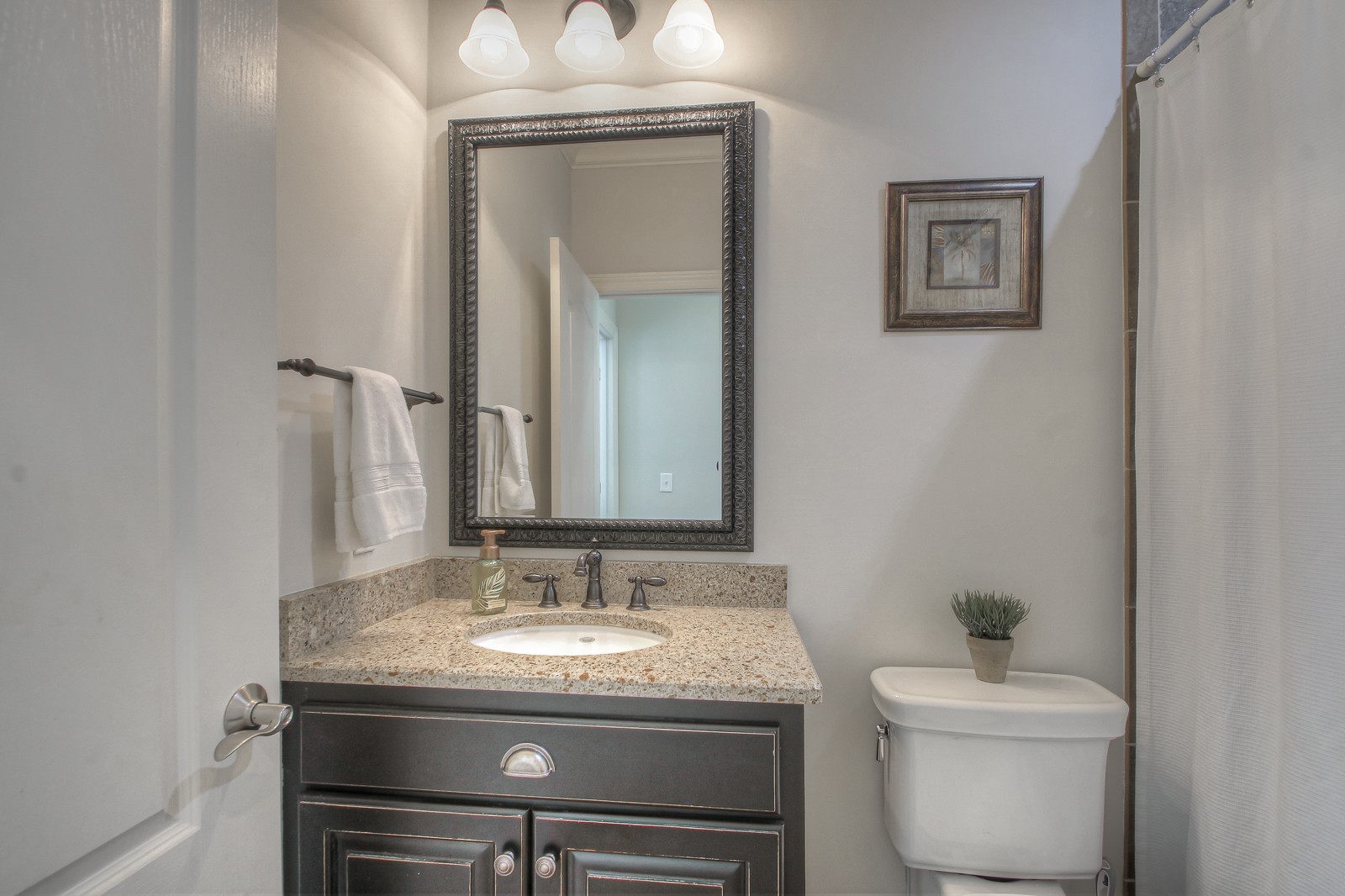 9251 Link Road Christiana, TN 37037 - Photo 14 of 40 a bathroom with a granite countertop toilet sink and mirror