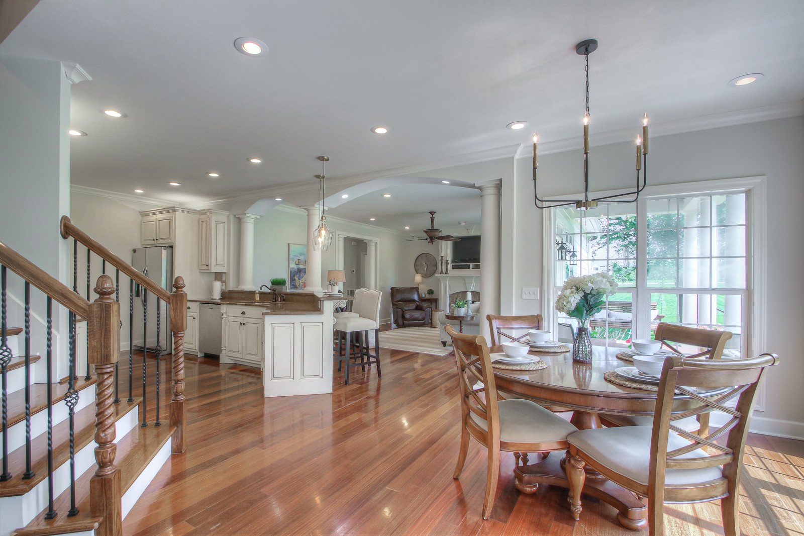 9251 Link Road Christiana, TN 37037 - Photo 18 of 40 a view of a dining room and livingroom with furniture wooden floor kitchen chandelier