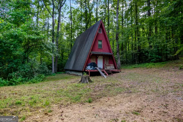 a view of wooden deck with a small yard