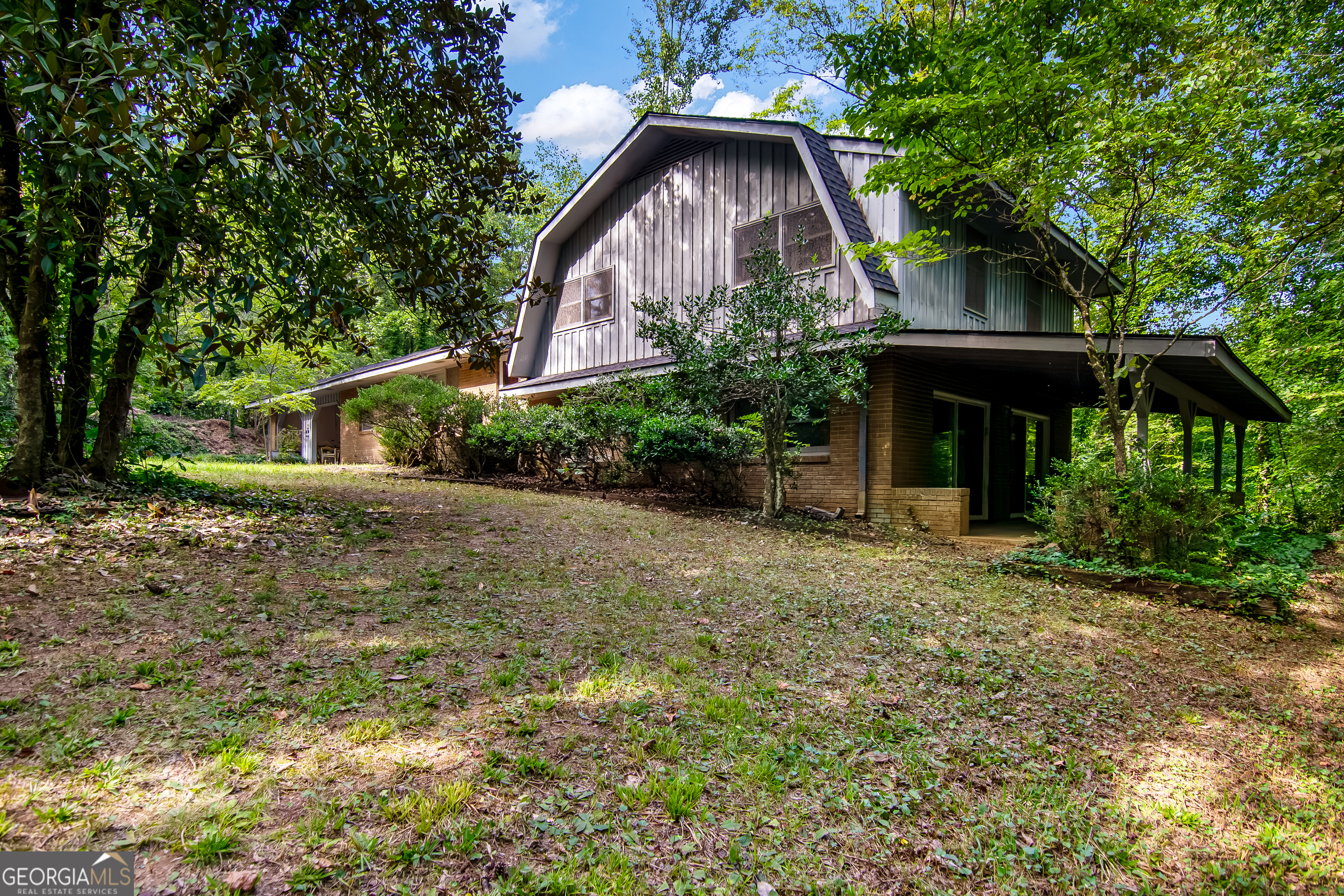 2063 Canton Road Nelson, GA 30143 - Photo 7 of 18 a front view of the house with a yard and trees