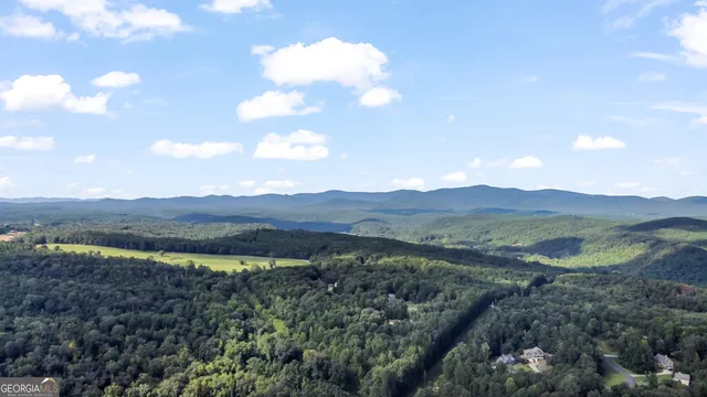 a view of a lake with mountains in the background
