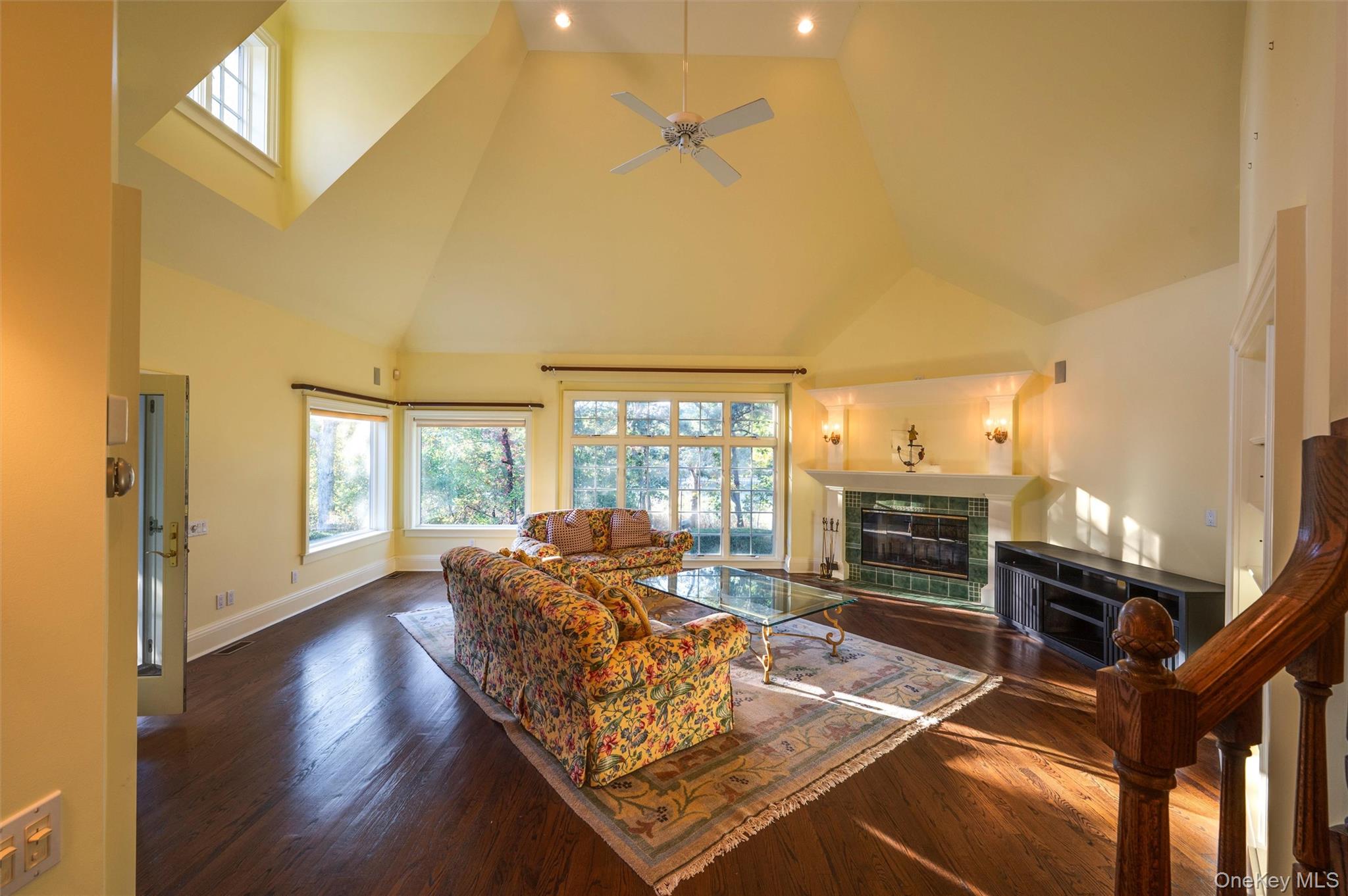 8 Fish Creek Lane Remsenburg, NY 11960 - Photo 12 of 34 a living room with fireplace furniture and a floor to ceiling window