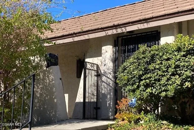 a view of a house with a tree