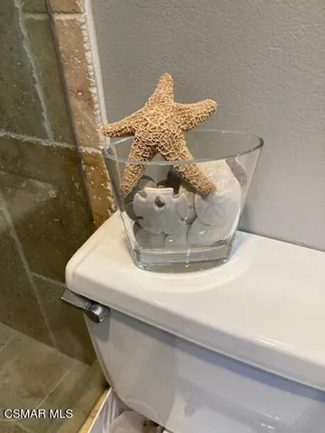 a bathroom with a toilet and a sink