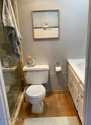 a bedroom with a bed and a table