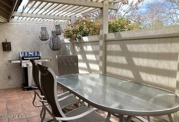 a swimming pool with lots of tress in front of it