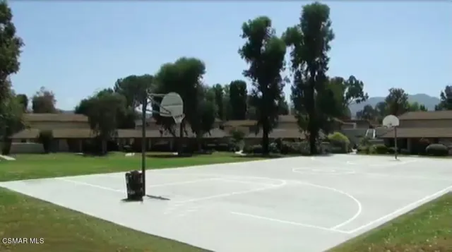 a view of a fence and yard