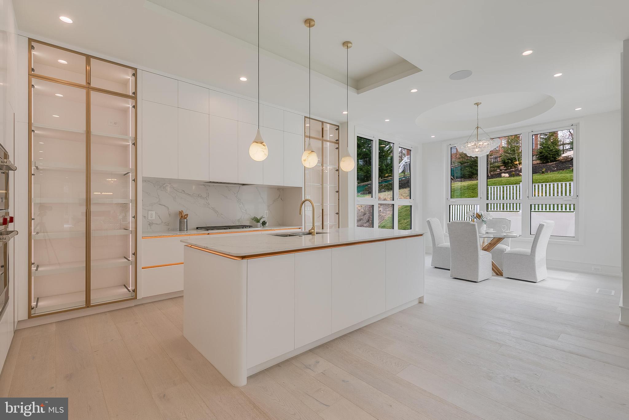 8757 Brook Road McLean, VA 22102 - Photo 15 of 51 a large white kitchen with a large window