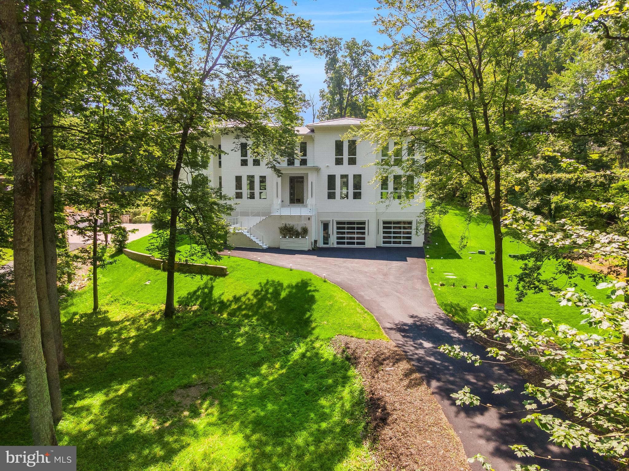 8757 Brook Road McLean, VA 22102 - Photo 2 of 51 a front view of a house with garden