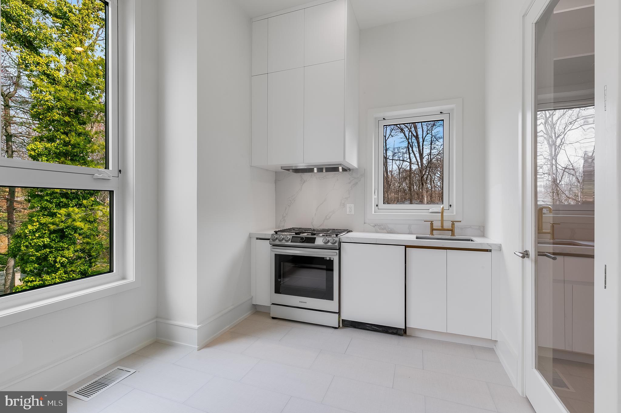 8757 Brook Road McLean, VA 22102 - Photo 22 of 51 a kitchen with a stove and a refrigerator