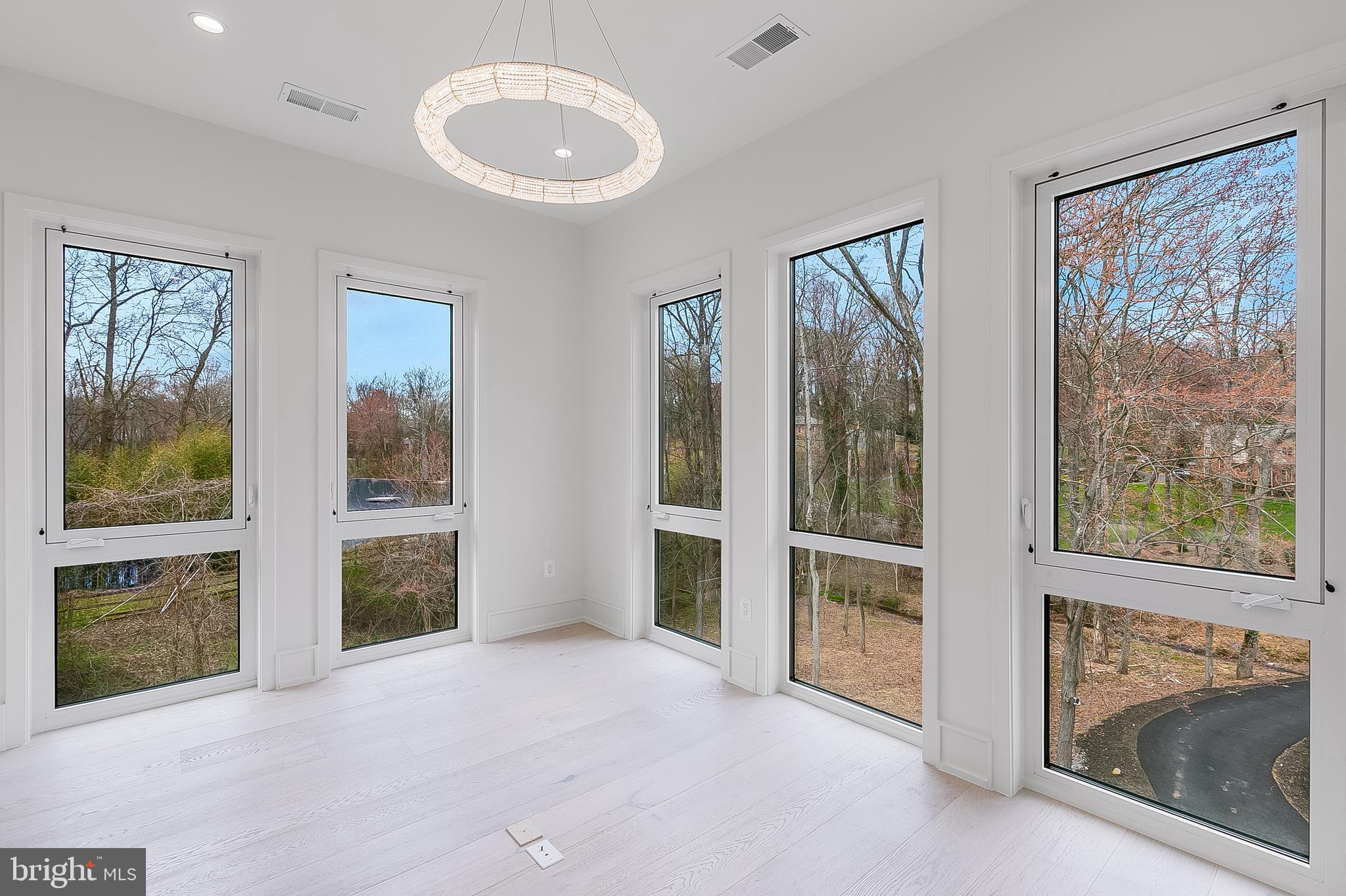 8757 Brook Road McLean, VA 22102 - Photo 29 of 51 a view of an empty room with glass door and a window