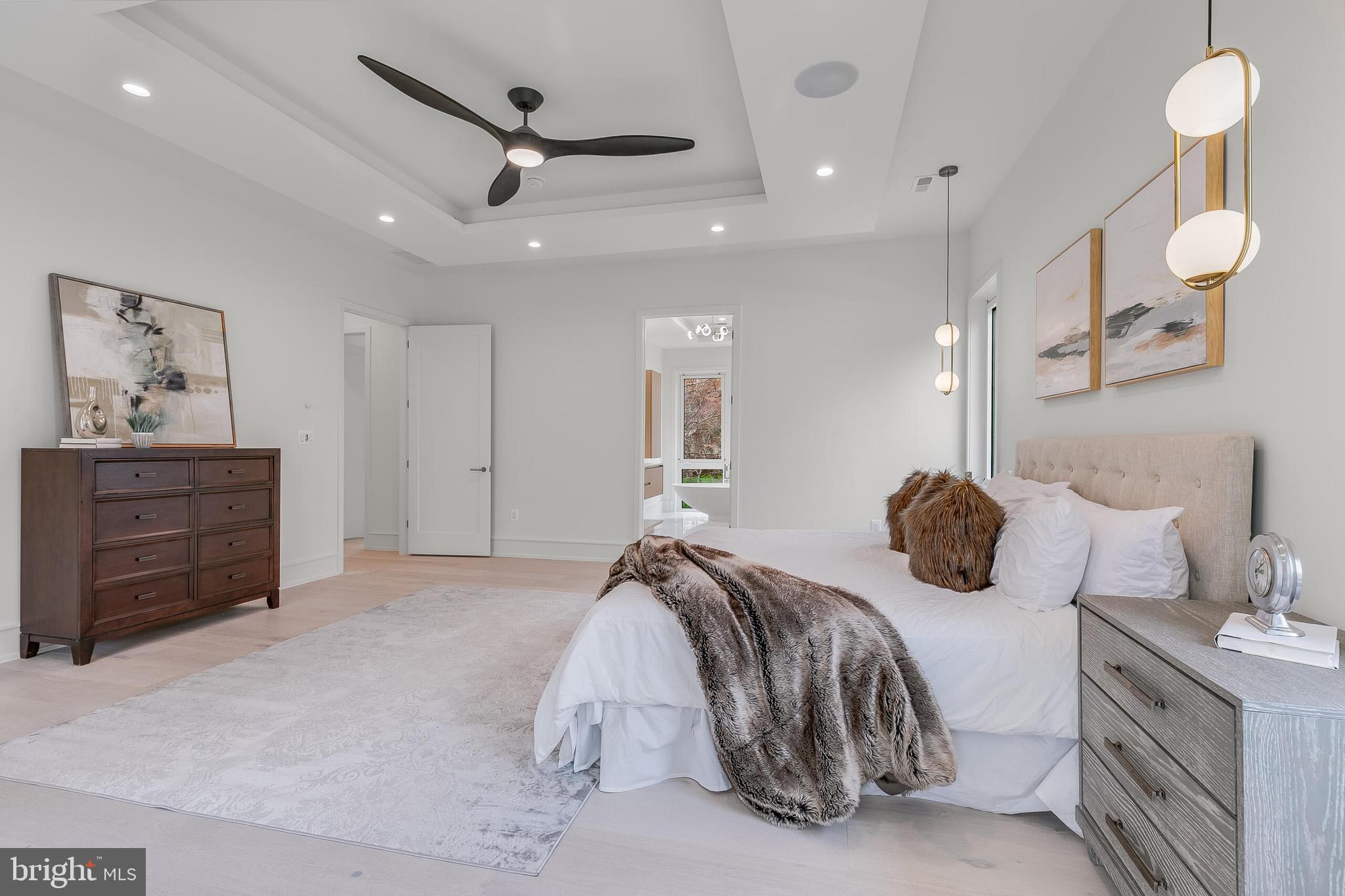 8757 Brook Road McLean, VA 22102 - Photo 31 of 51 a bedroom with a bed and a chandelier