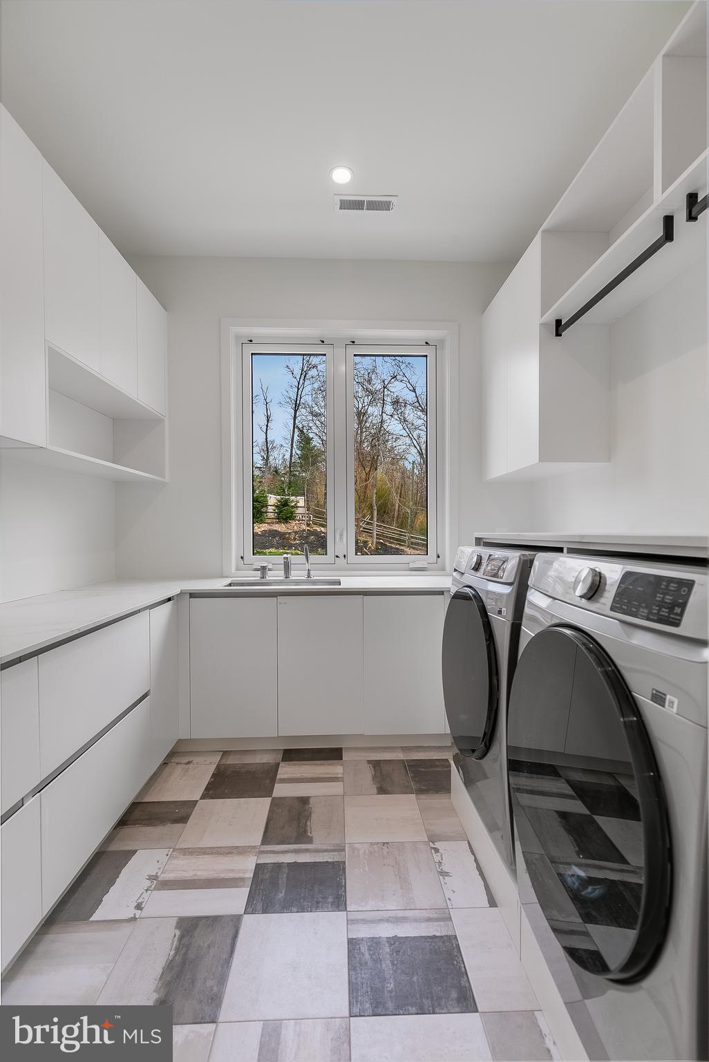 8757 Brook Road McLean, VA 22102 - Photo 39 of 51 a view of utility room with washer and dryer
