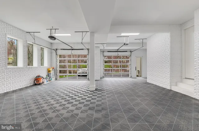 a aerial view of a house with a big yard and large trees