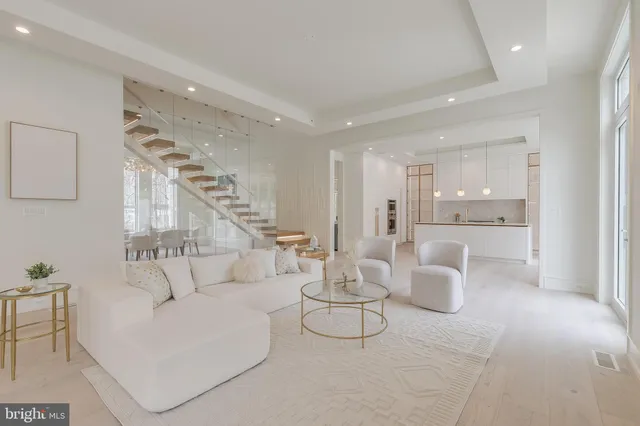 a living room with furniture and a painting