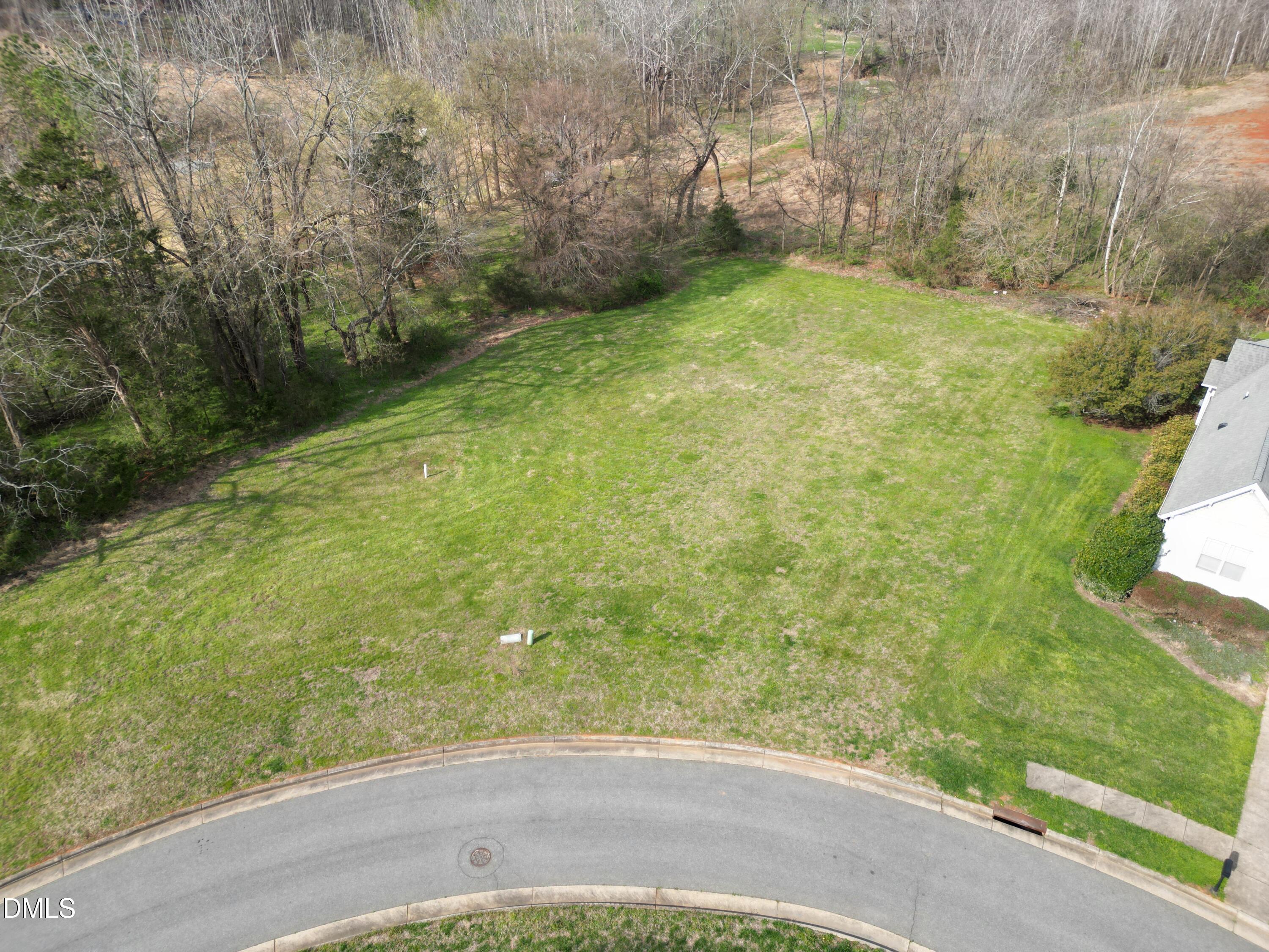 216 Single Tree Circle Haw River, NC 27258 - Photo 2 of 2 a view of a yard with an trees