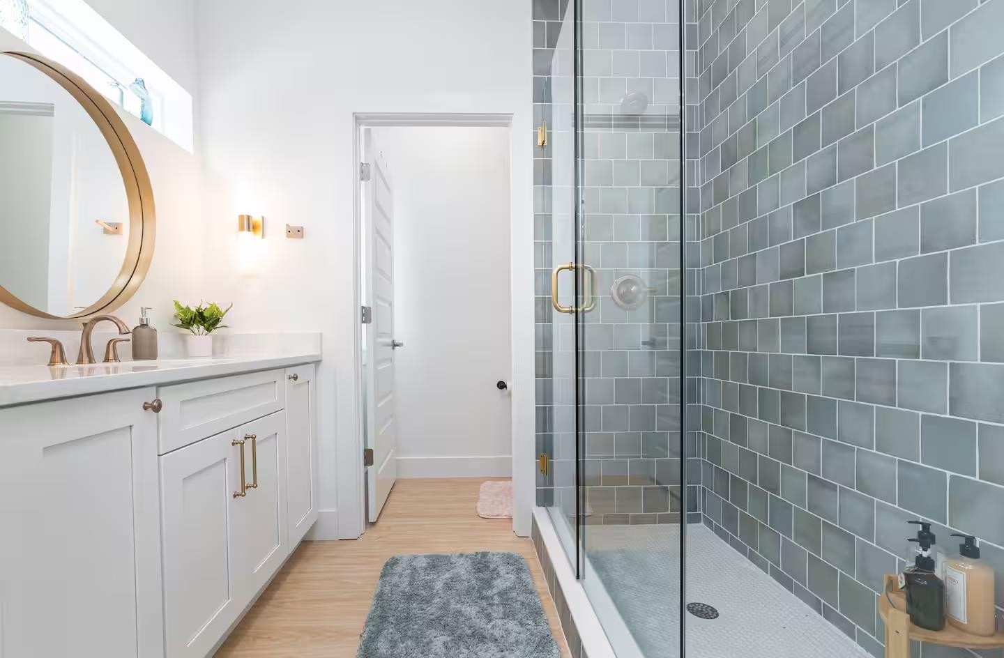 600 Twenty-First Street St. Augustine, FL 32084 - Photo 15 of 32 a spacious bathroom with a granite countertop sink a mirror and shower