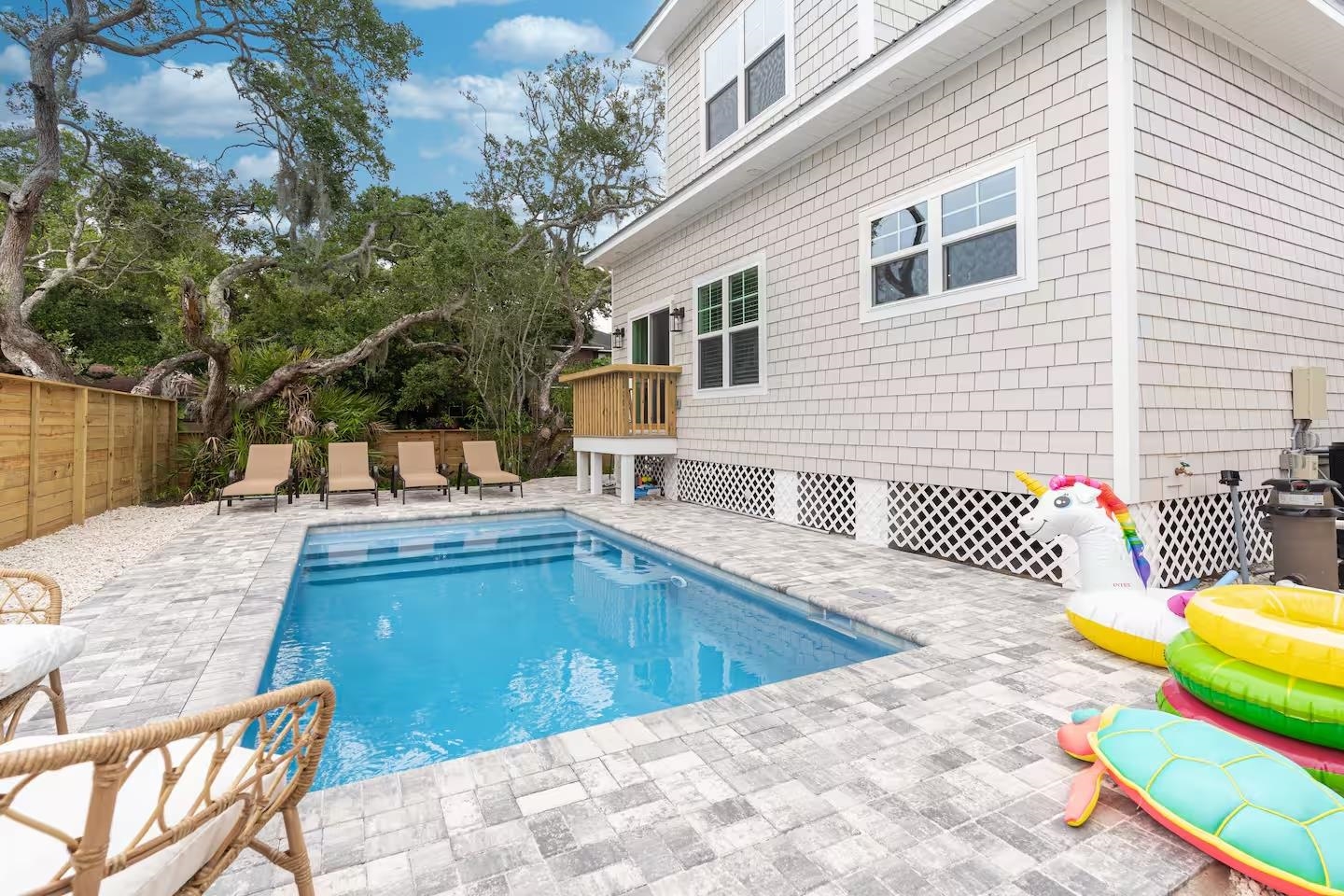 600 Twenty-First Street St. Augustine, FL 32084 - Photo 2 of 32 a view of a swimming pool with a lounge chairs