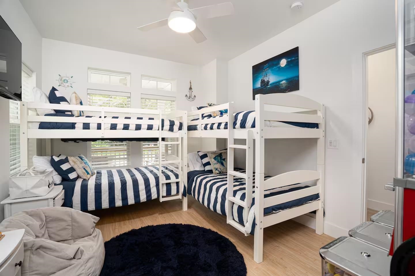 600 Twenty-First Street St. Augustine, FL 32084 - Photo 21 of 32 a bedroom with furniture and a flat screen tv