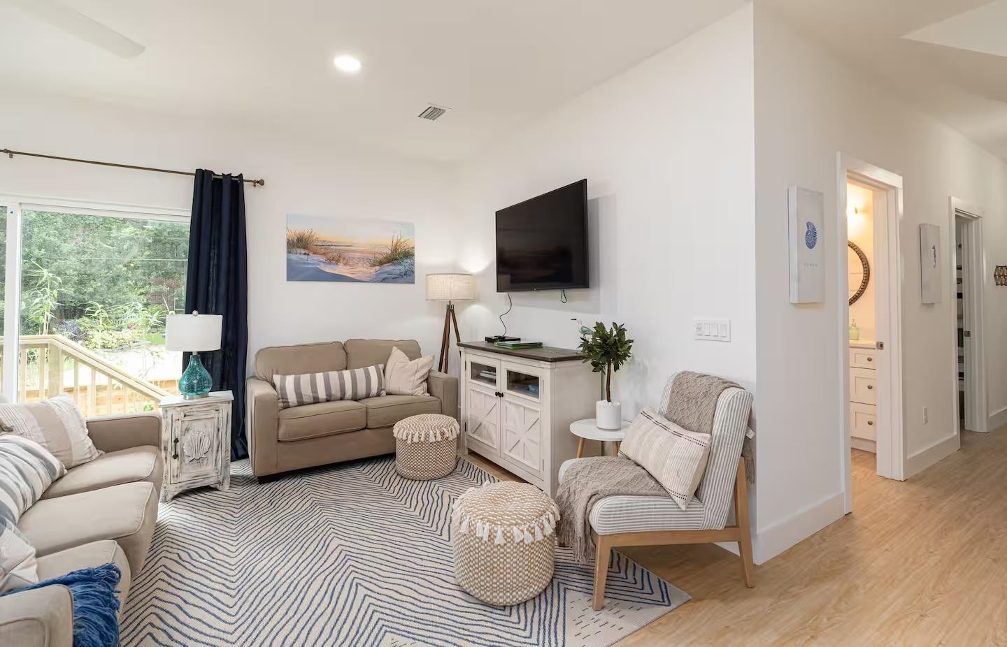 600 Twenty-First Street St. Augustine, FL 32084 - Photo 8 of 32 a living room with furniture a flat screen tv and a large window