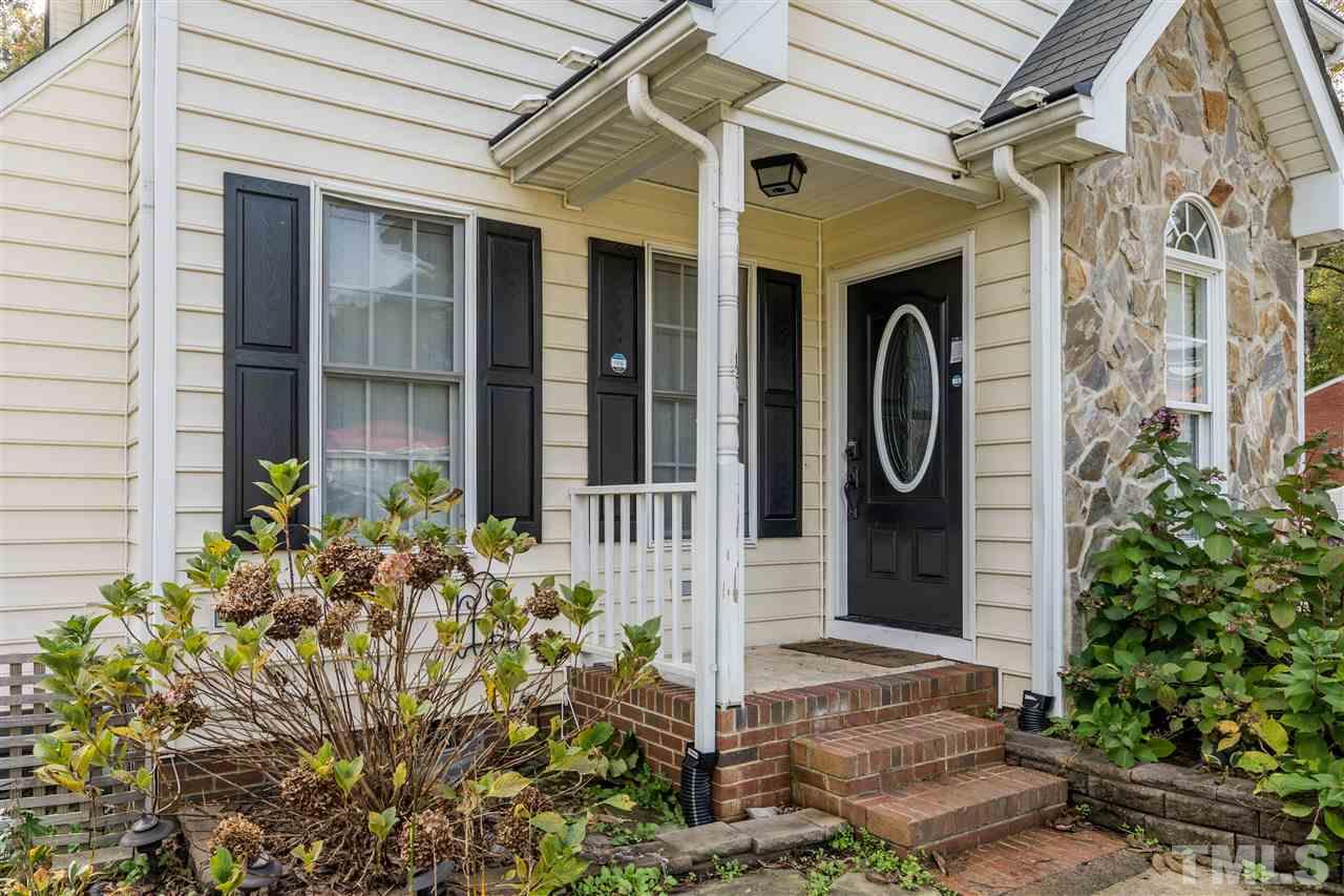 501 Woodland Road Raleigh, NC 27603 - Photo 3 of 28 a front view of a house with a garden