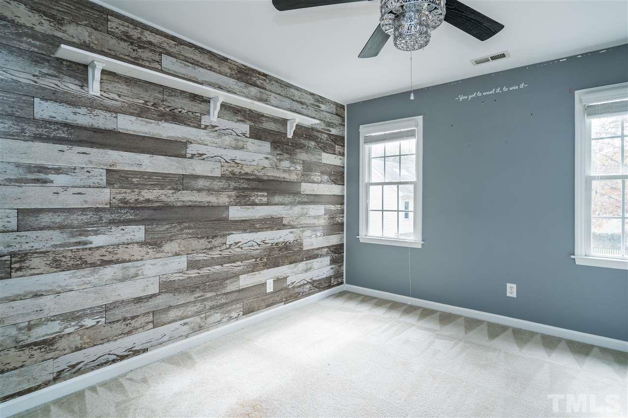 501 Woodland Road Raleigh, NC 27603 - Photo 22 of 28 a view of room with window and ceiling fan