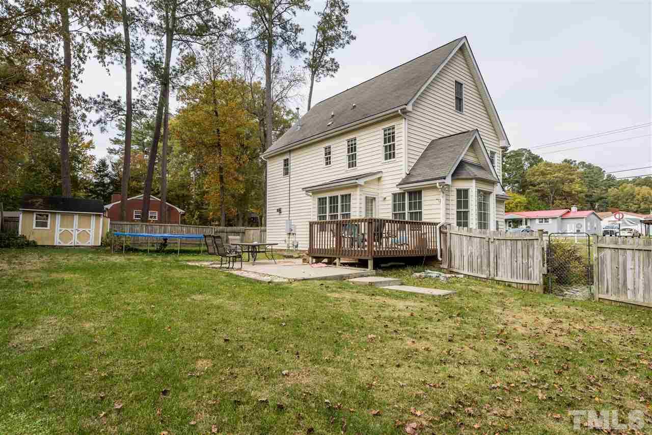 501 Woodland Road Raleigh, NC 27603 - Photo 4 of 28 a view of a house with a yard balcony and sitting area
