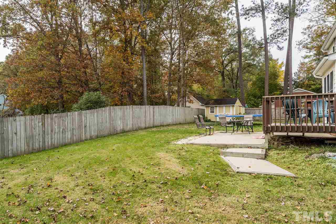 501 Woodland Road Raleigh, NC 27603 - Photo 5 of 28 a swimming pool with wooden fence