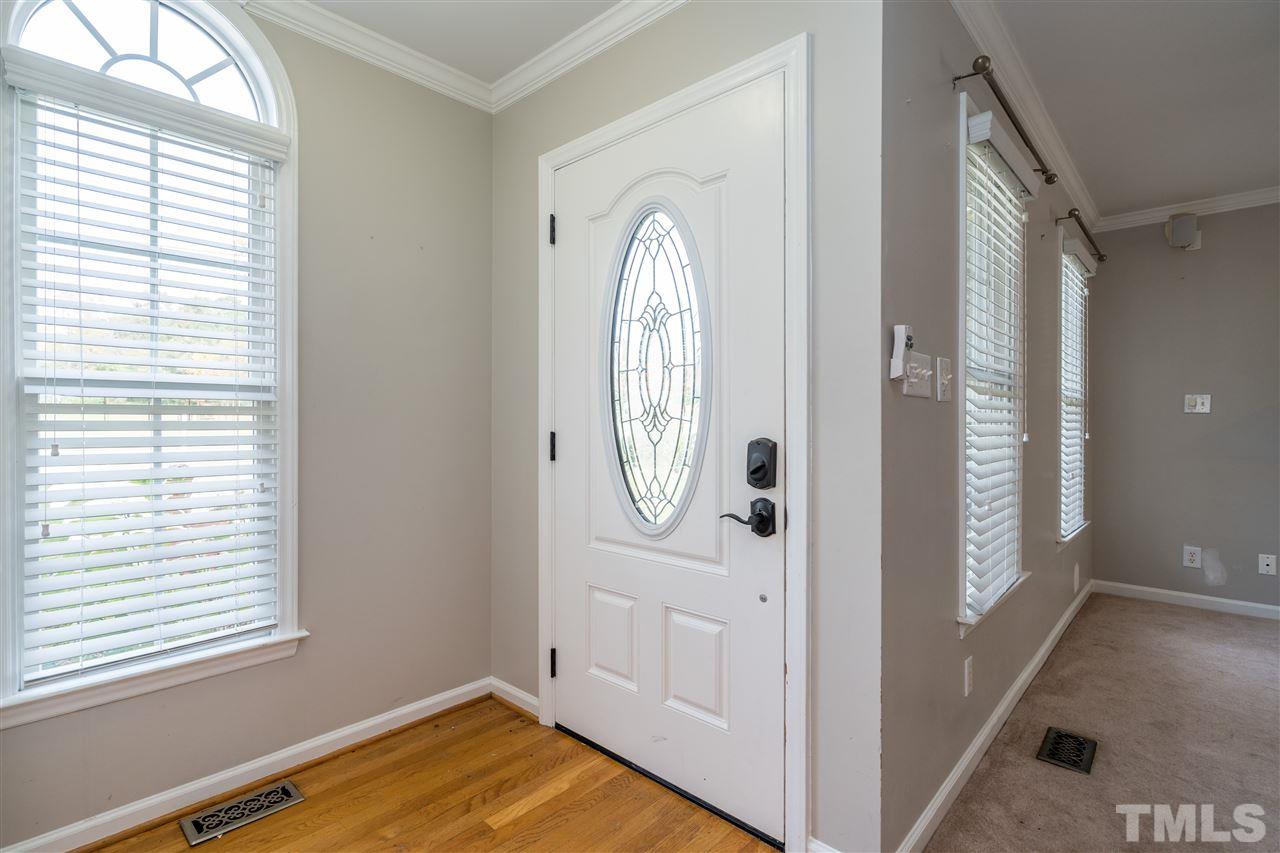 501 Woodland Road Raleigh, NC 27603 - Photo 6 of 28 a view of a livingroom with wooden floor and window
